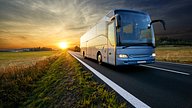 coach driving on road
