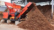 stock image of a shredder producing wood chippings