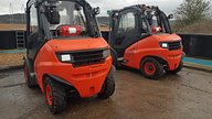 a pair of Linde forklifts with Ardent lay flat systems installed